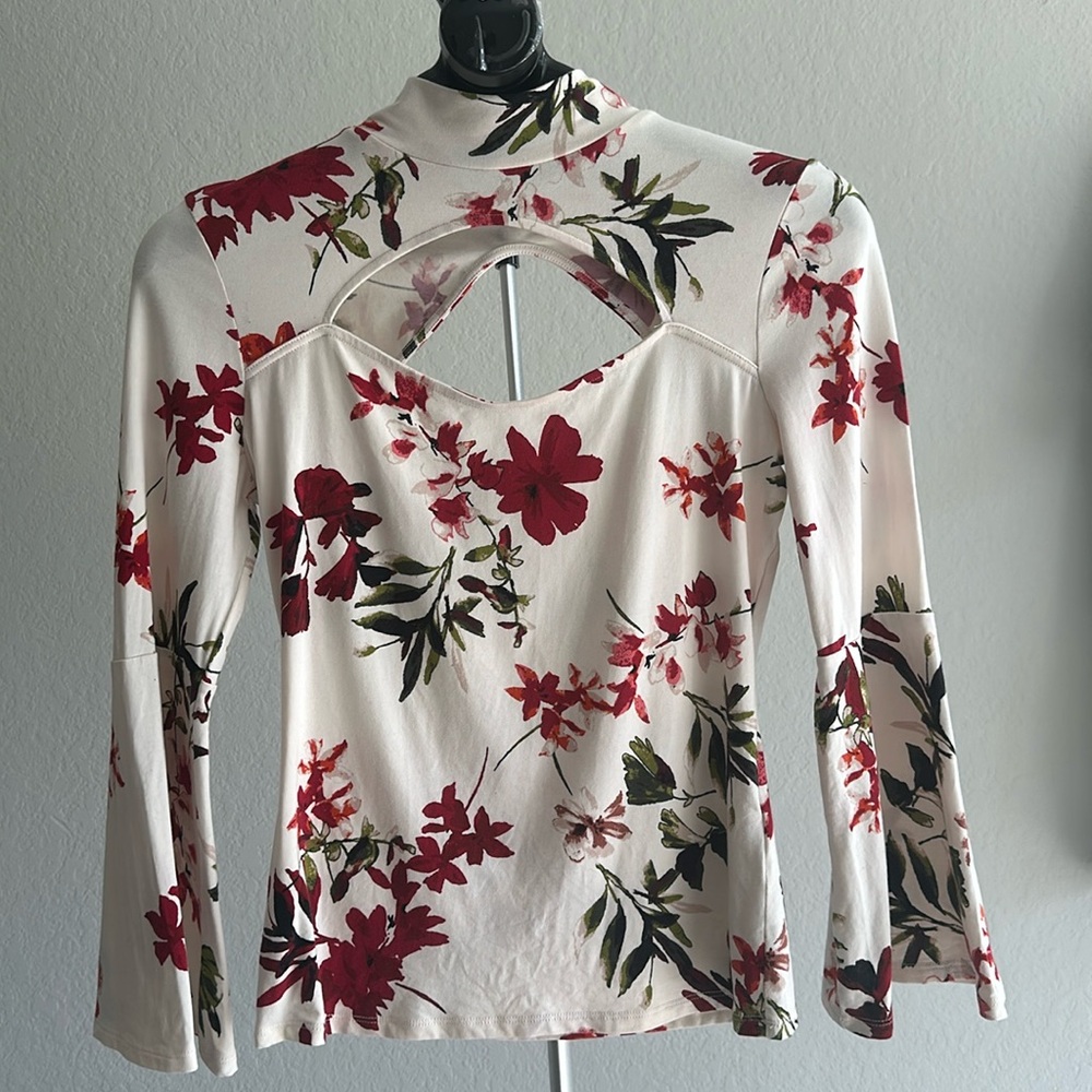 Floral top by Guess. Size M